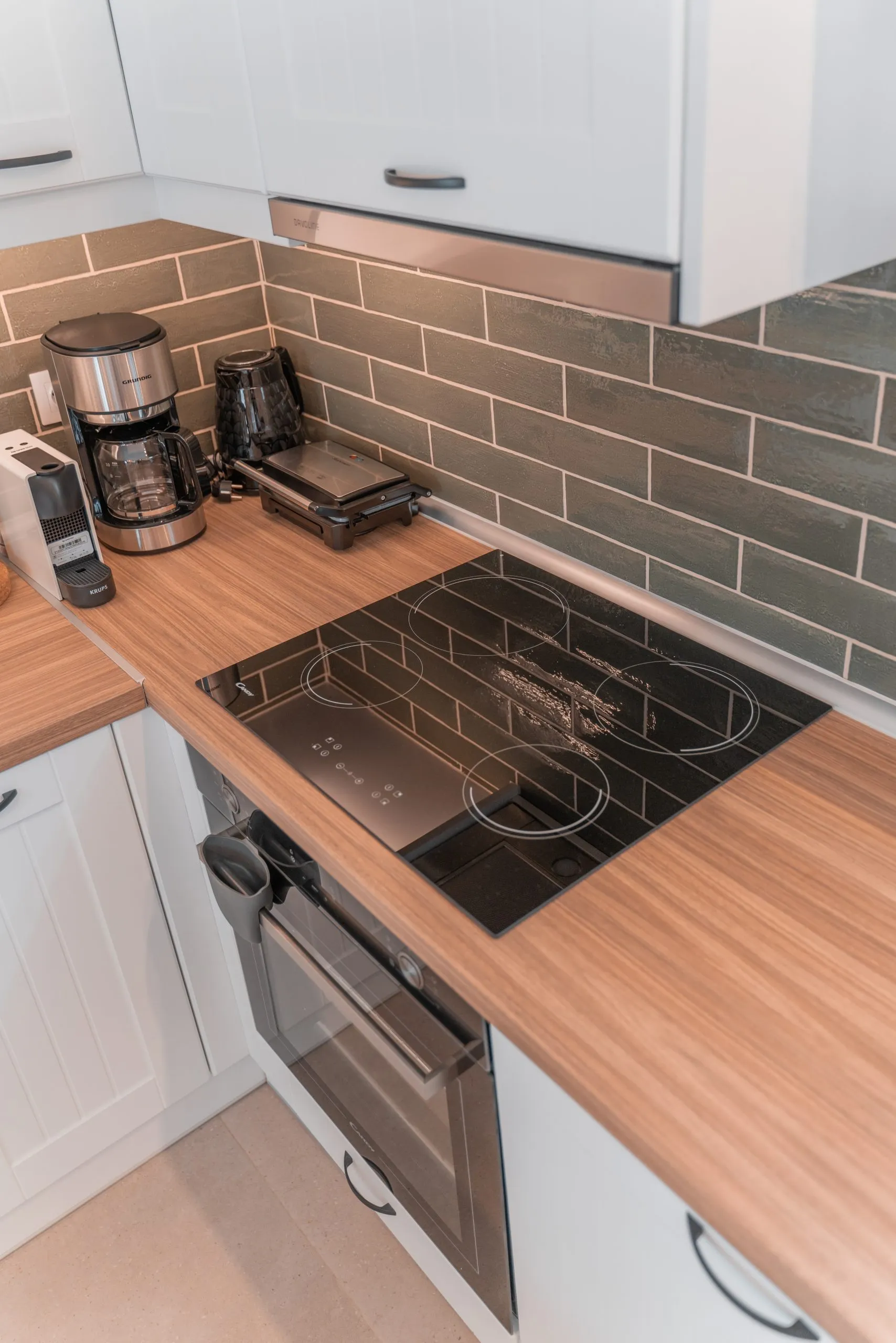 Kitchen worktop with induction hob and coffee machine