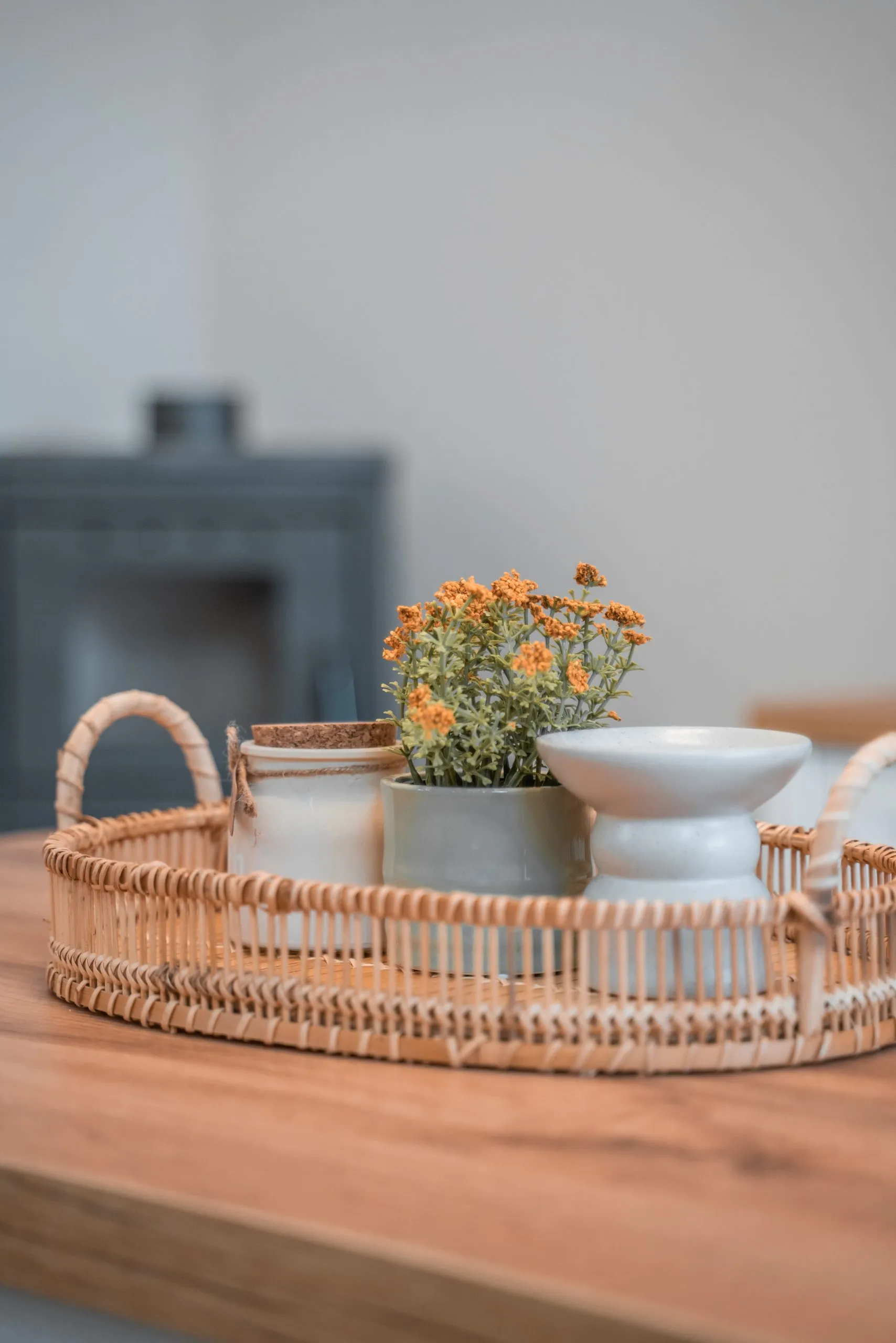 Wicker tray with flowers on the coffee table