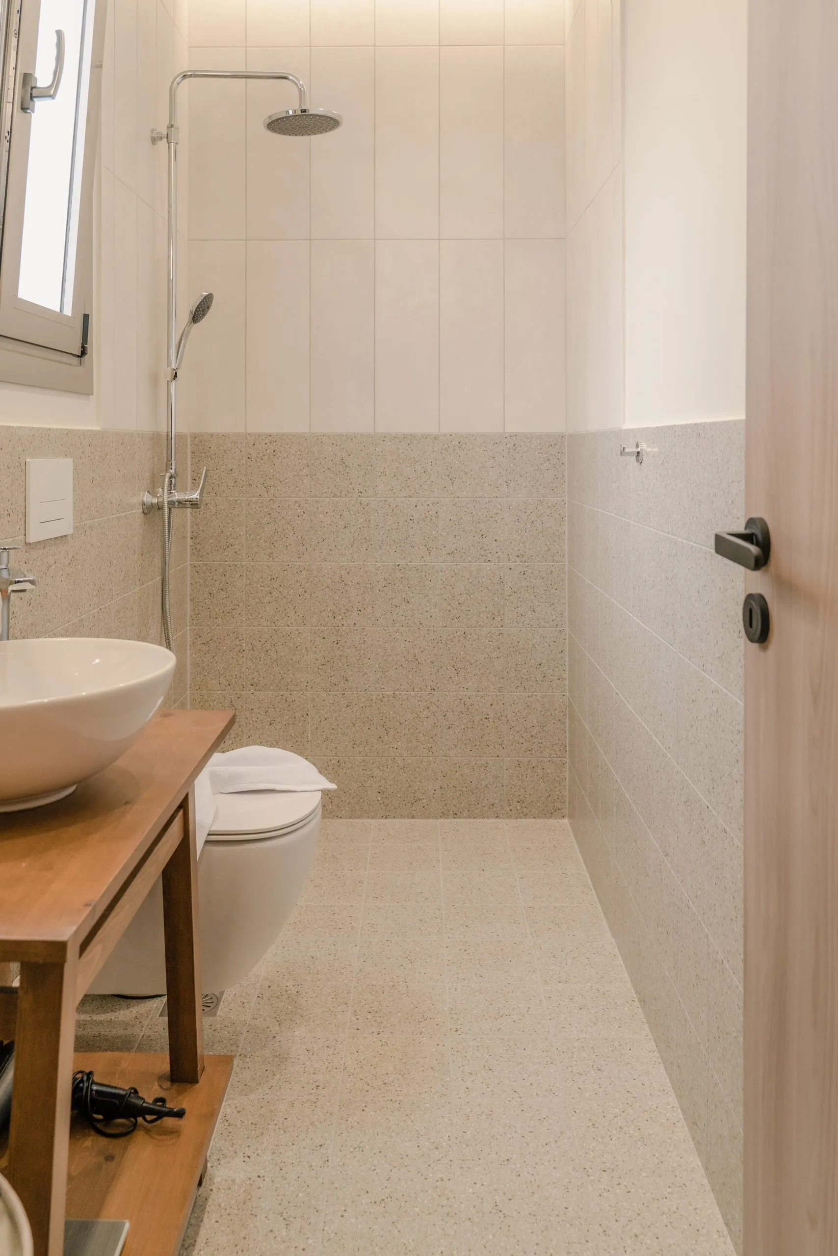 Bathroom with walk-in shower and vessel sink